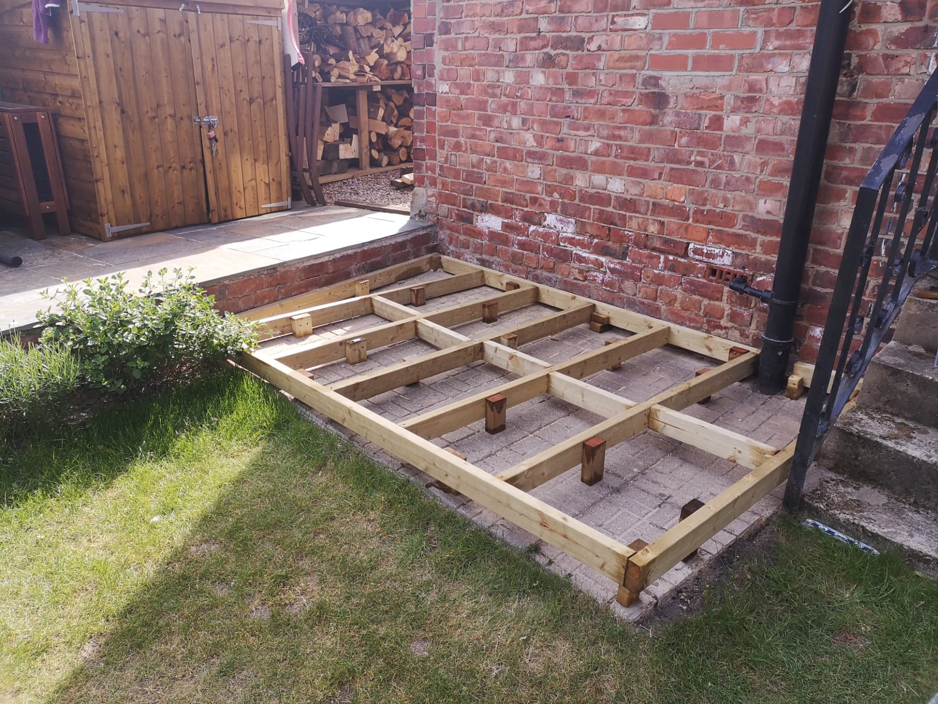 Garden decking — timber frame and joists laid out and levelled